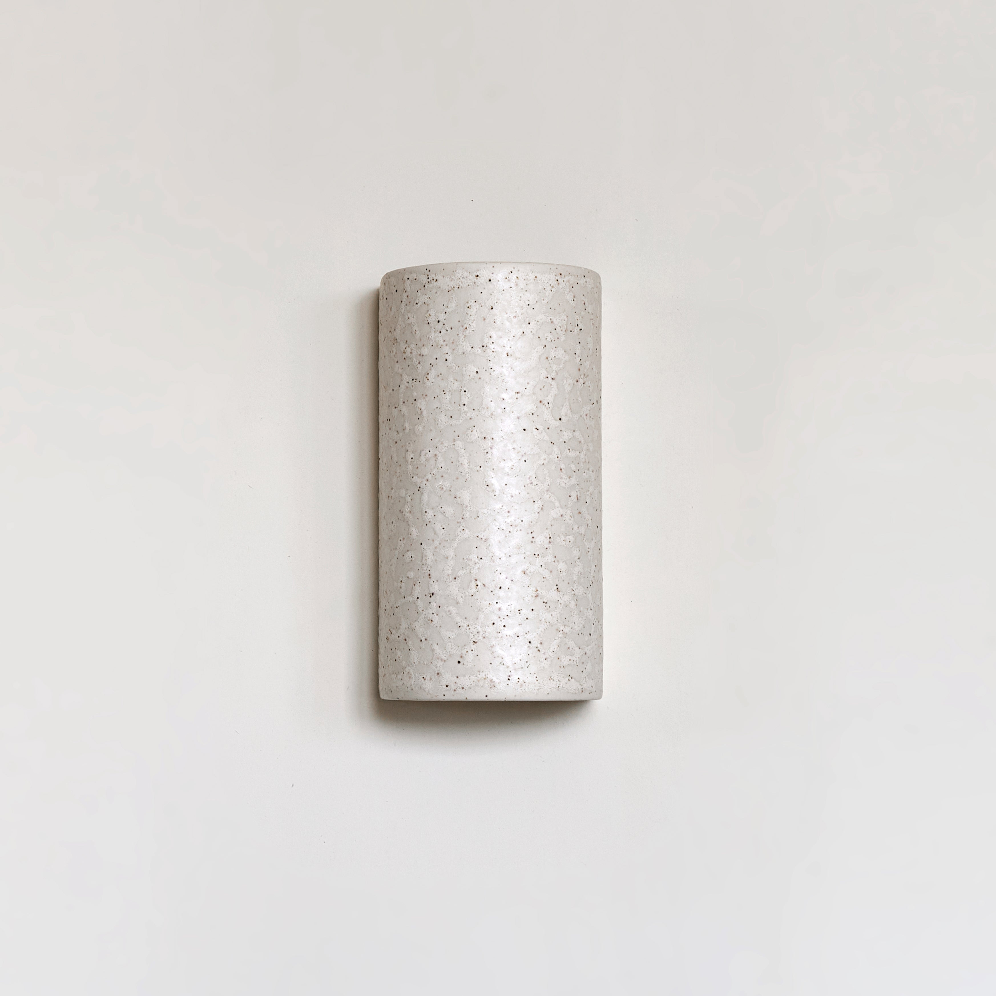 Textured ceramic wall light