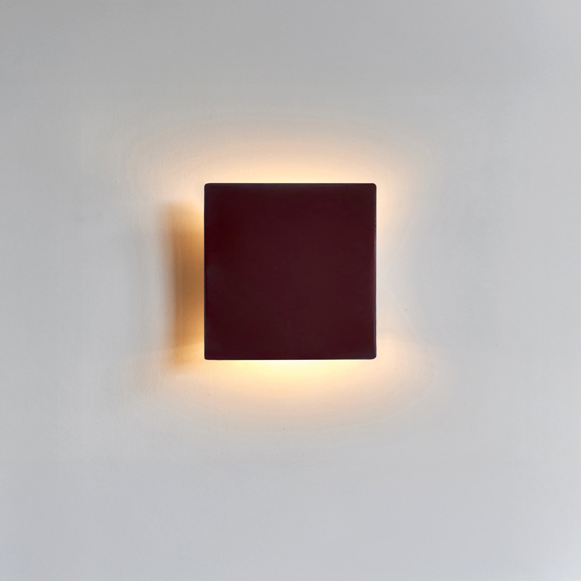 Ceramic wall light creating a soft ambient glow