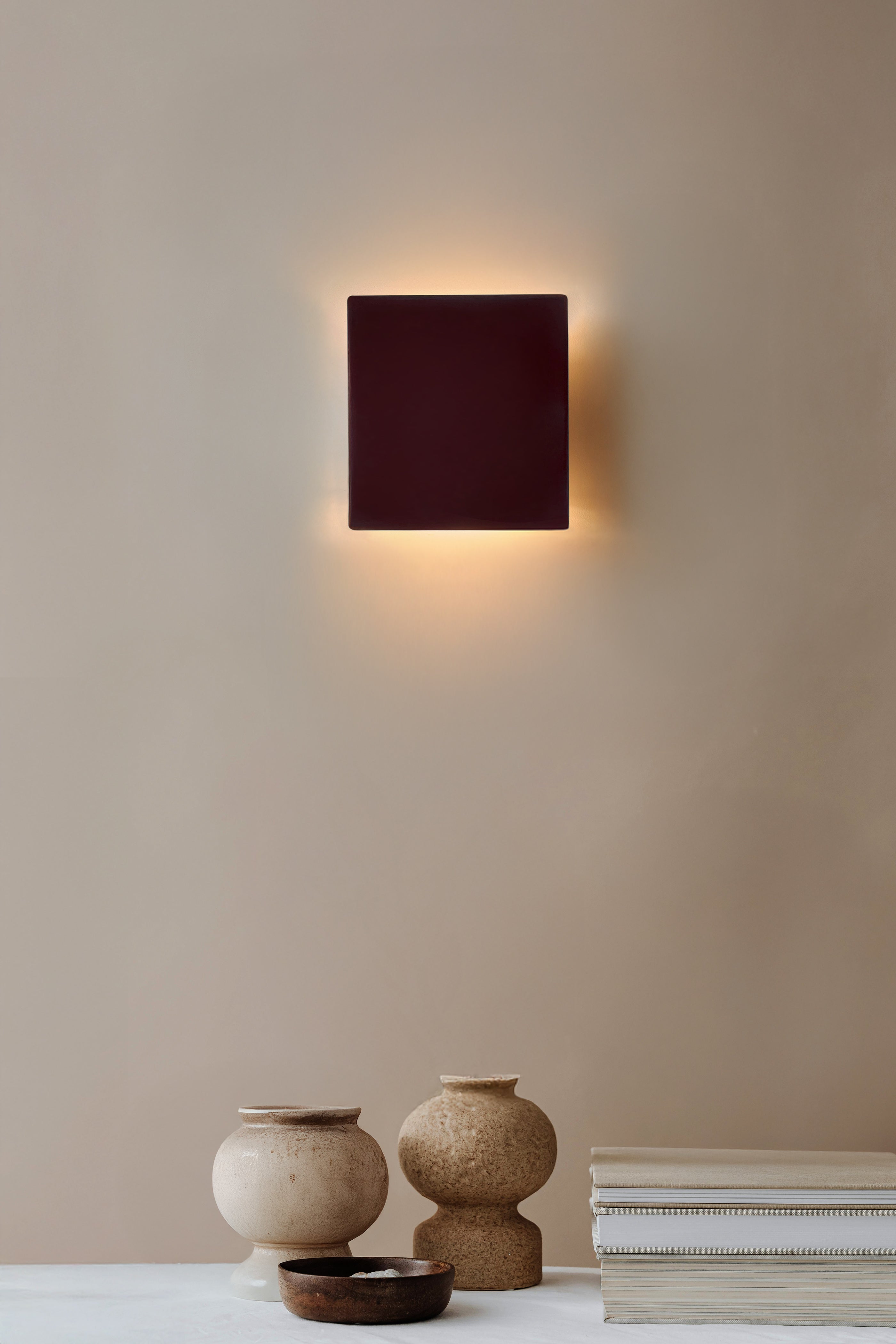Ceramic wall light creating a soft ambient glow