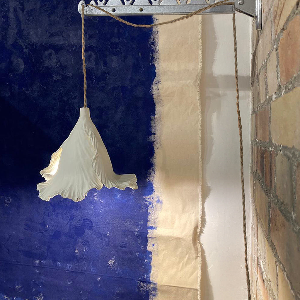 Ceramic wall lamp designed for subtle lighting